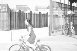 Overexposed woman on a bike