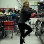 girl black pants stripped top dancing in laundrymat