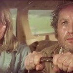 close up man and woman in a car staring at something off screen