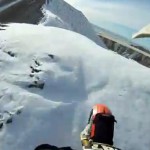 front tire of dirtbike in snow on mountain top