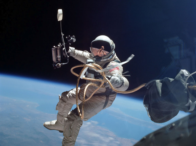 Astronaut in space suit earth in background