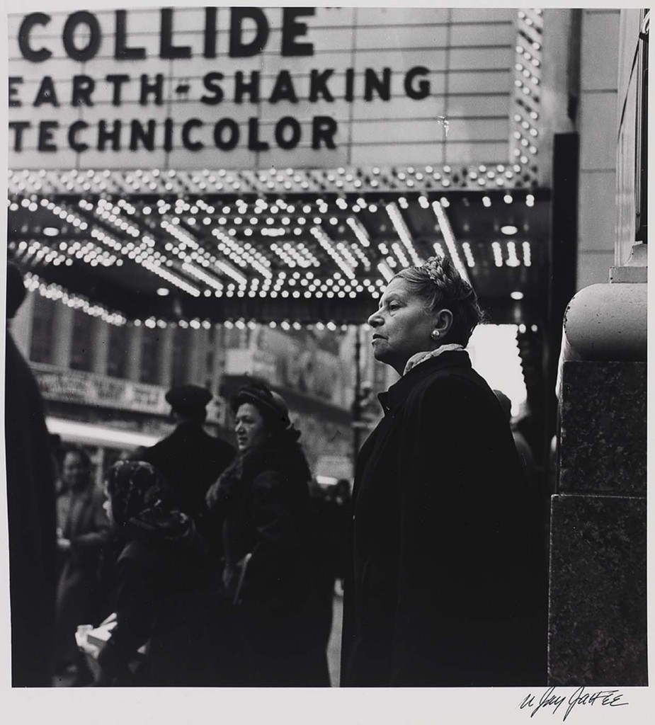 Woman under movie theater marquee in 1949, photographer N. Jay Jaffee