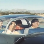 1950s famil in the car of the future