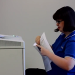 Woman shredding papers